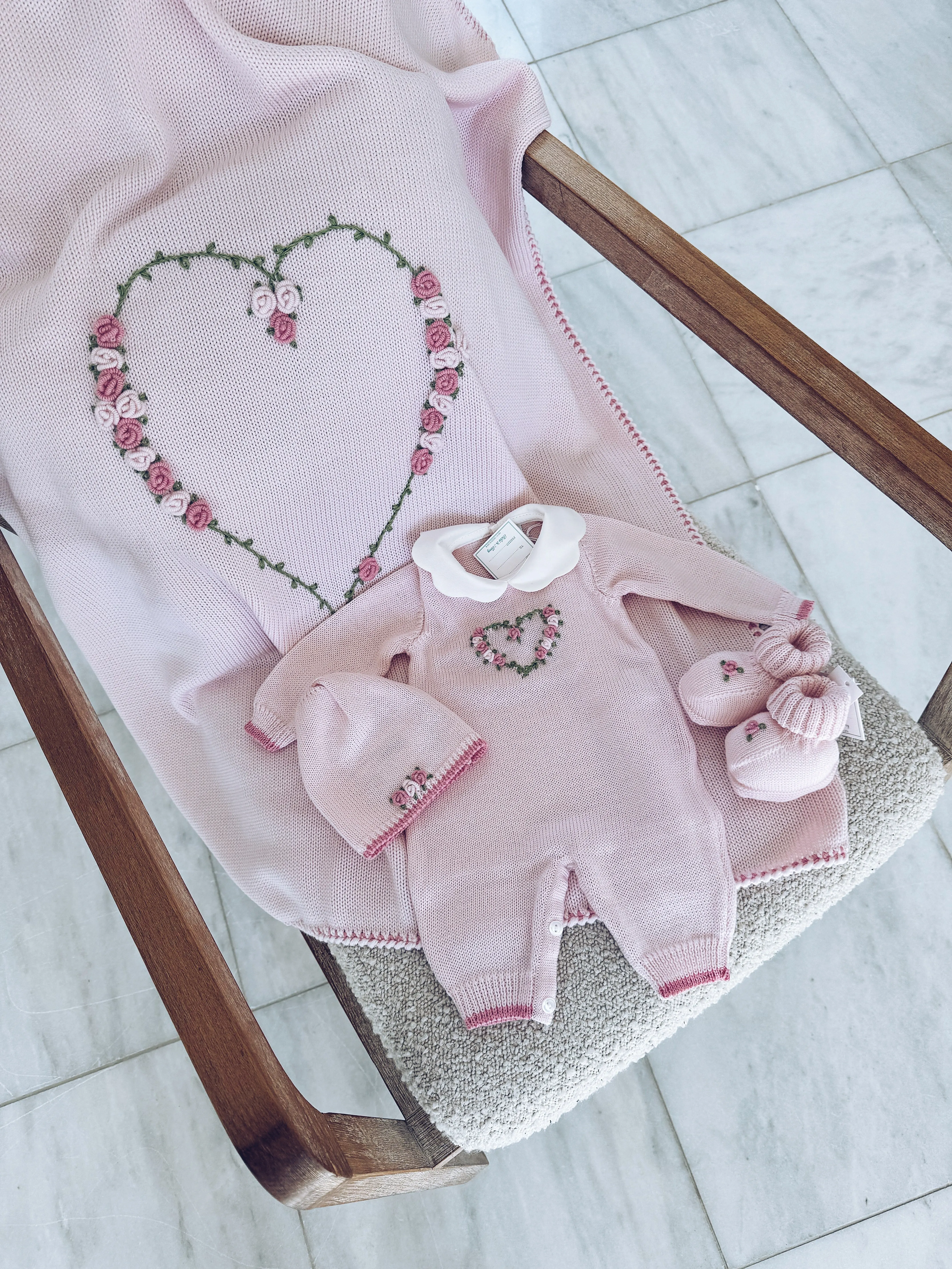 Beautiful Knitted Merino Wool Baby Girl Blanket with hand embroidery flower details.