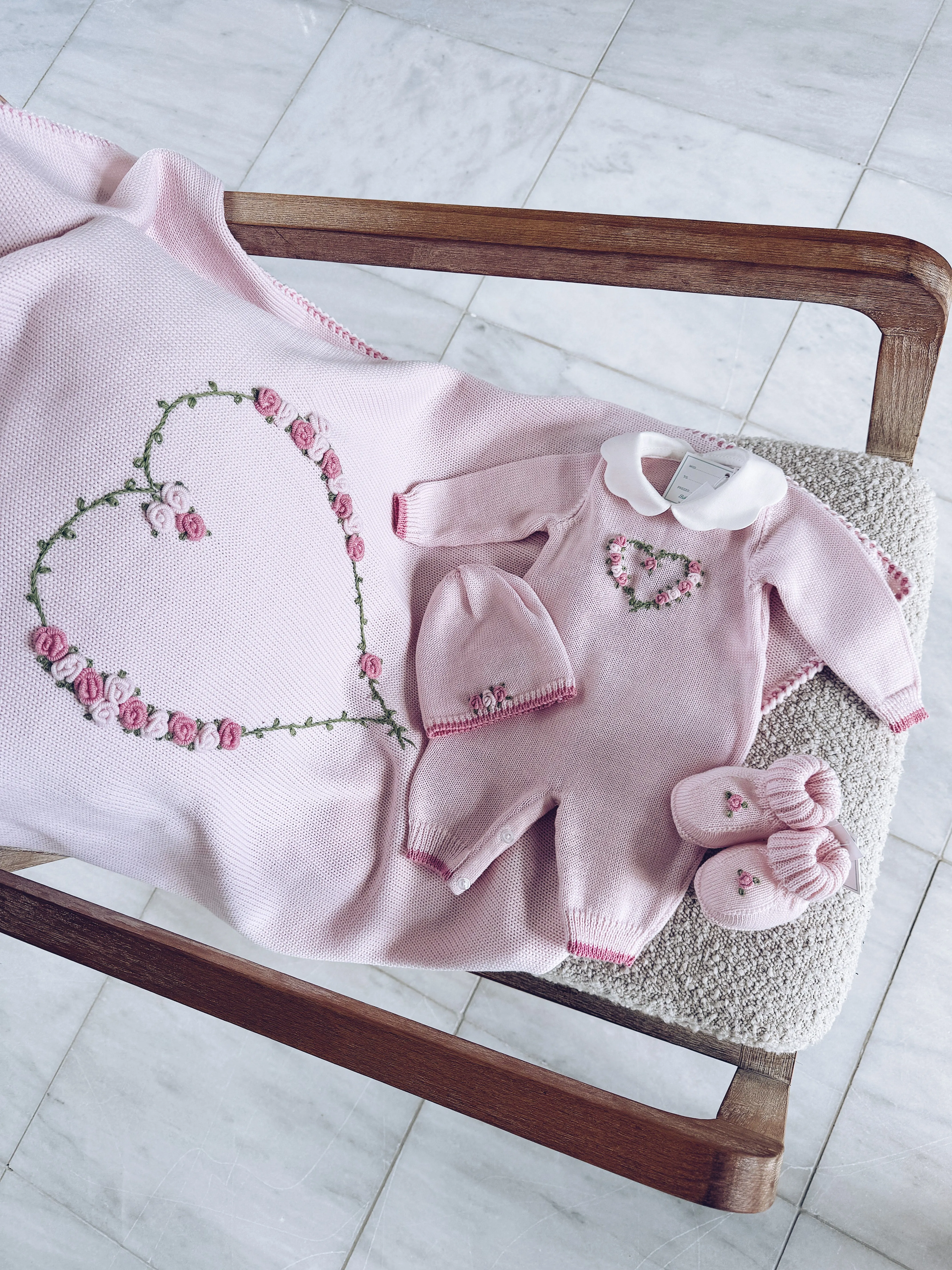 Beautiful Knitted Merino Wool Baby Girl Blanket with hand embroidery flower details.