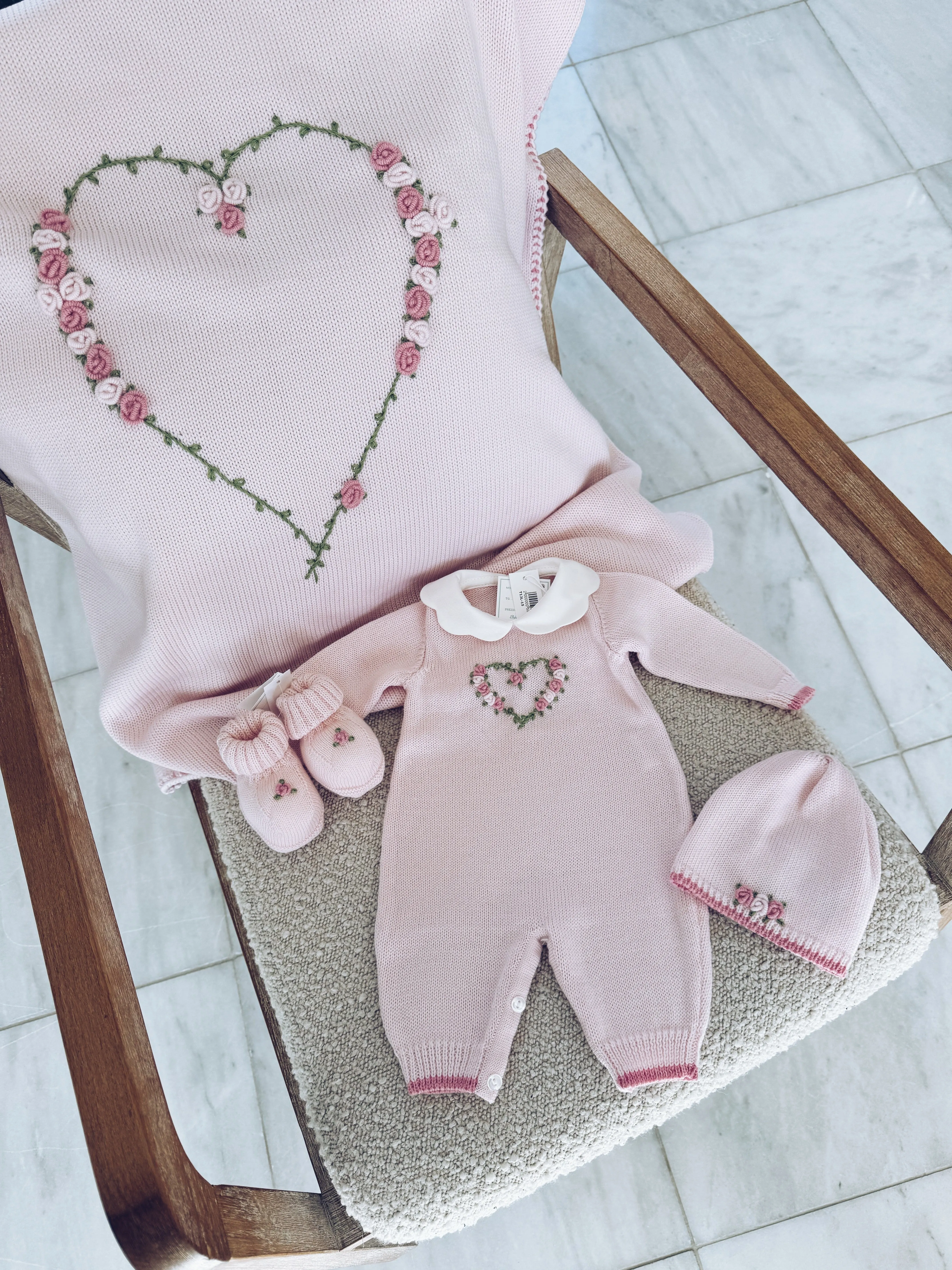 Beautiful Knitted Merino Wool Baby Girl Blanket with hand embroidery flower details.