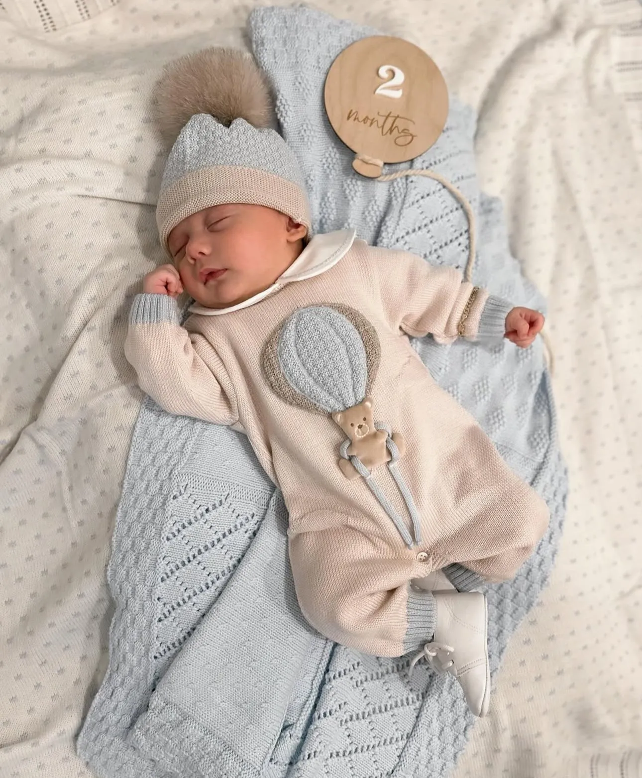 Beautiful knitted Merino Wool Cream/Blue Baby Romper with Bear/Air Ballon details.