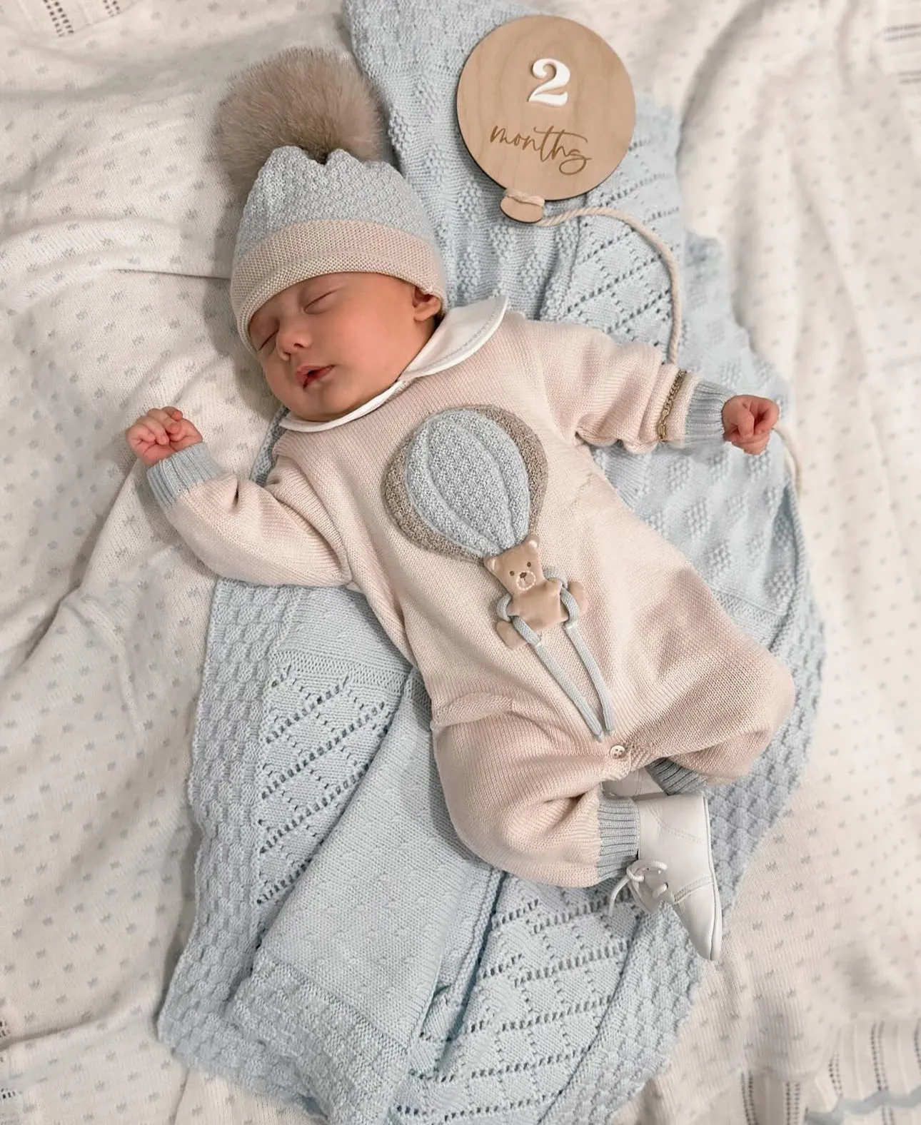 Beautiful knitted Merino Wool Cream/Blue Baby Romper with Bear/Air Ballon details.