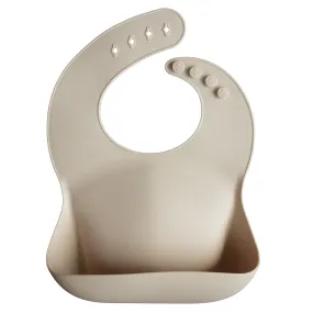 Mushie Silicone Baby Bib in Shifting Sand
